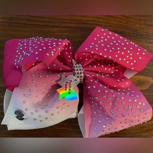 Jojo Siwa signature collection Fuscia Fade Bow hair clip.